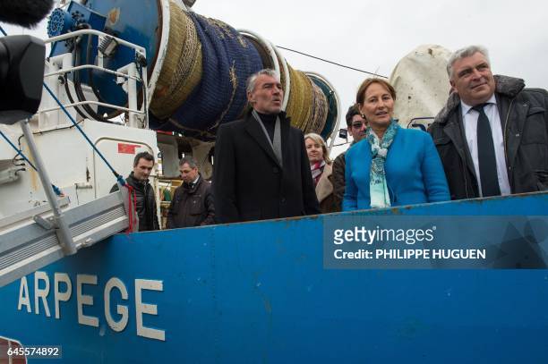 French Environment Minister Segolene Royal stands beside French socialist lawmaker and Boulogne-sur-Mer mayor Frederic Cuvillier aboard a...