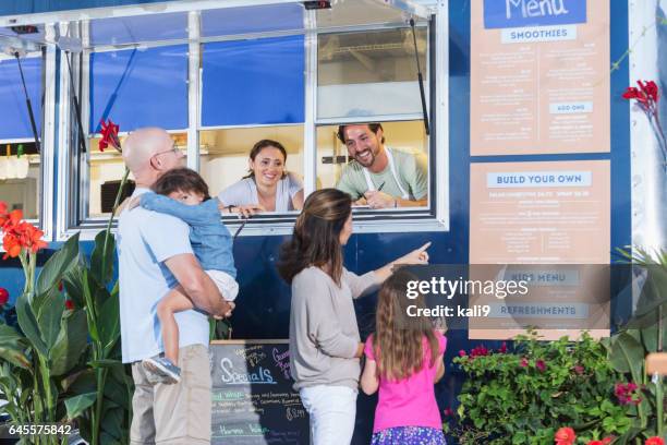 workers in food truck helping customers - demanding kid stock pictures, royalty-free photos & images