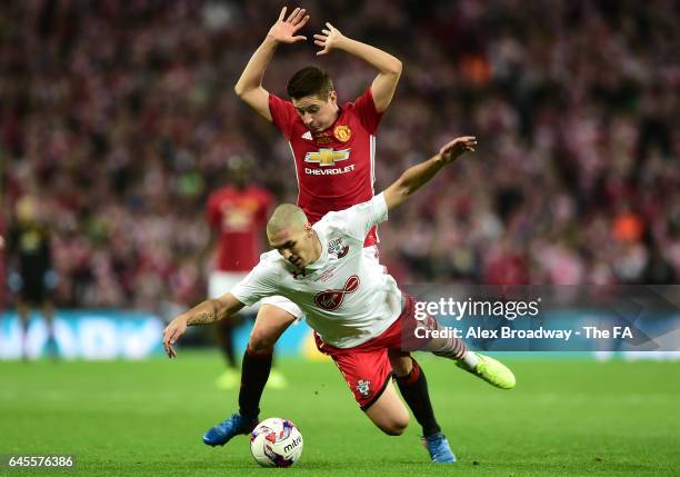 Oriol Romeu of Southampton battles with Ander Herrera of Manchester United during the EFL Cup Final between Manchester United and Southampton at...