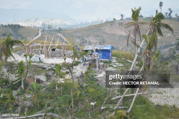 View is seen of a house on the top of a mountain, in the commune of Port-Salut, southwestern Haiti, on February 25 where the vegetation was severely...