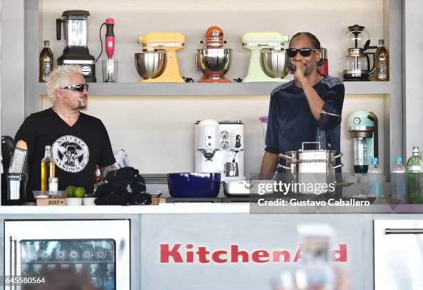 Guy Fieri and Snoop Dogg cook on stage at Goya Foods' Grand Tasting Village Featuring Mastercard Grand Tasting Tents & KitchenAid Culinary...