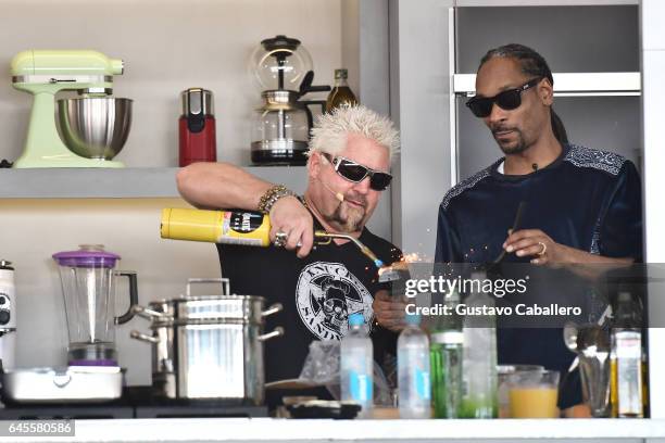 Guy Fieri and Snoop Dogg cook on stage at Goya Foods' Grand Tasting Village Featuring Mastercard Grand Tasting Tents & KitchenAid Culinary...