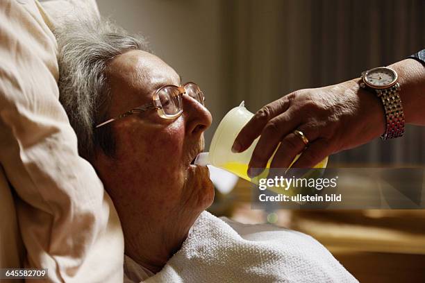 People, old age, retirement home, Altenzentrum der St. Clemens Hospitale in Sterkrade, older woman lies in a sickbed, aged 70 to 85 years, physical...