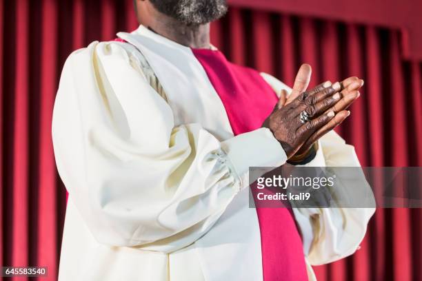 cropped view of black man in church choir robe - preacher stock pictures, royalty-free photos & images