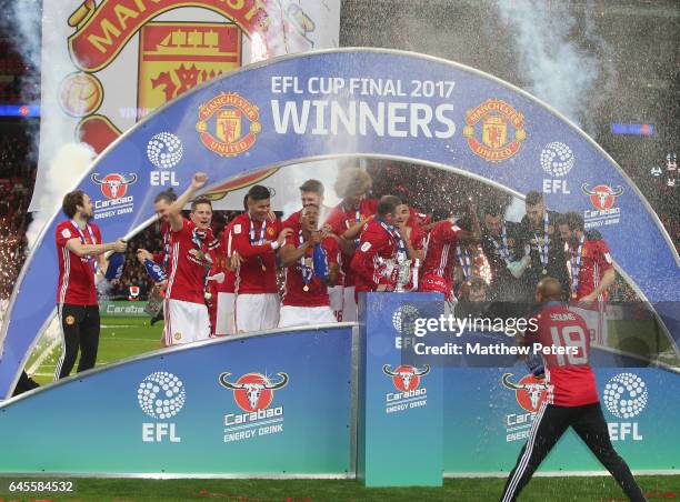 Daley Blind, Ander Herrera, Marcos Rojo, Antonio Valencia, Wayne Rooney and Ashley Young of Manchester United celebrate after the EFL Cup Final match...