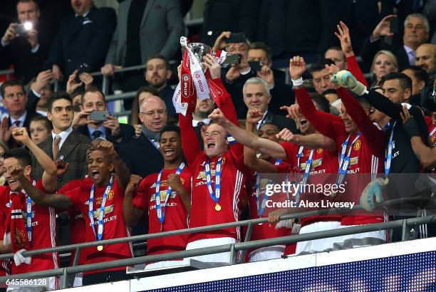 Manchester United celebrate victory with the trophy after during the EFL Cup Final between Manchester United and Southampton at Wembley Stadium on...