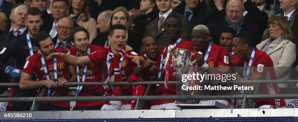 Paul Pogba of Manchester United lifts the EFL Cup after the EFL Cup Final match between Manchester United and Southampton at Wembley Stadium on...