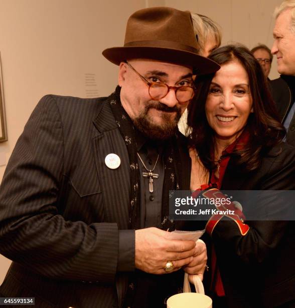 Guitarist Jimmy Vivino and author Olivia Harrison attend the "I ME MINE" George Harrison book launch at Subliminal Projects Gallery on February 25,...