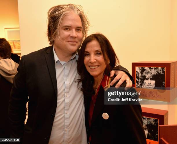 Chris Holmes and author Olivia Harrison attend the "I ME MINE" George Harrison book launch at Subliminal Projects Gallery on February 25, 2017 in Los...