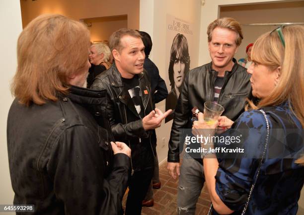Musician Geezer Butler of Black Sabbath, artist Shepard Fairey, and actor Cary Elwes attend the "I ME MINE" George Harrison book launch at Subliminal...
