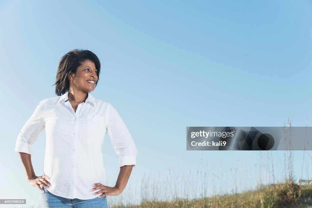 Confidence mature black woman, hands on hips