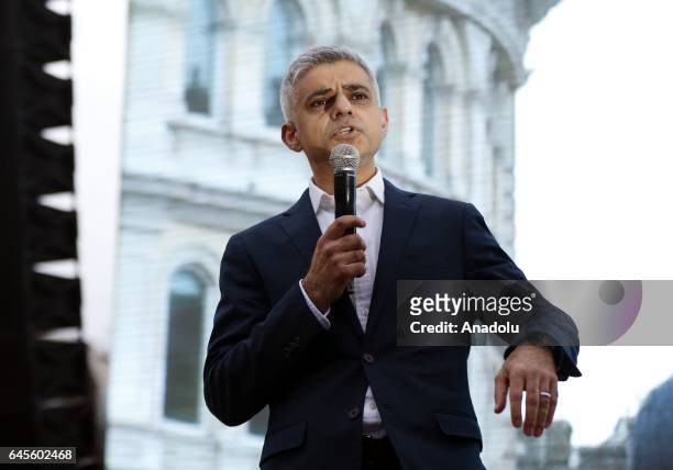 London Mayor Sadiq Khan addresses the crowd as thousands gather to watch a free screening and UK premier of Iranian film "The Salesman" in Trafalgar...