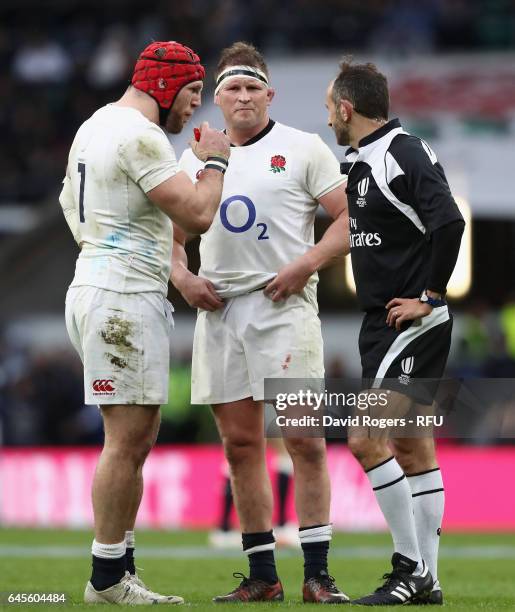 Dylan Hartley the England captain talks to referee Romain Poite as team mate James Haskell looks on during the RBS Six Nations match between England...