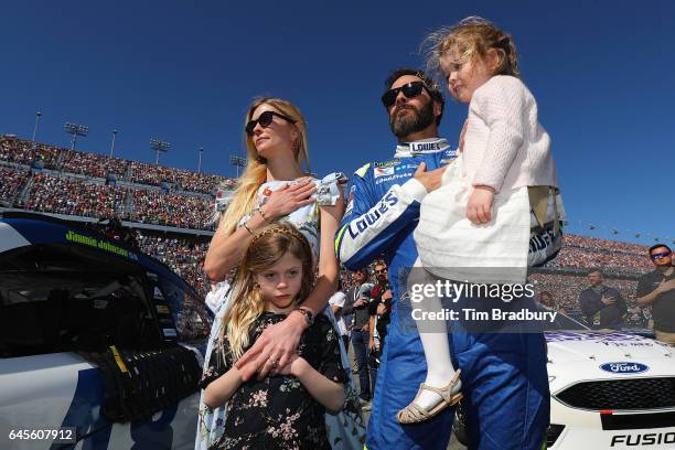 Jimmie Johnson, driver of the Lowe's Chevrolet, stands on the grid with his wife Chandra Johnson and their daughters Lydia Norriss Johnson and...