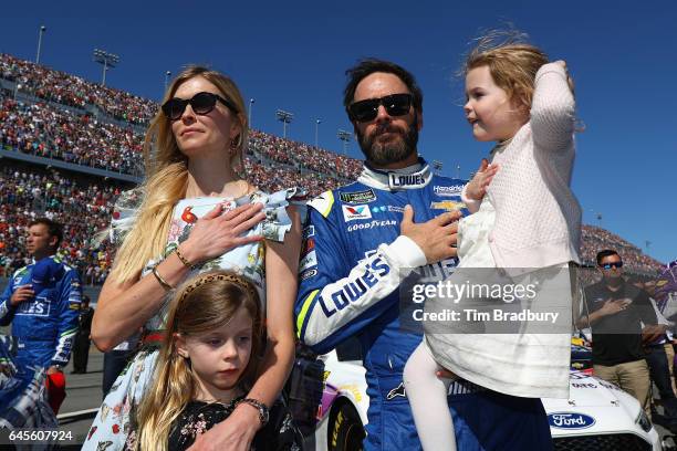 Jimmie Johnson, driver of the Lowe's Chevrolet, stands on the grid with his wife Chandra Johnson and their daughters Lydia Norriss Johnson and...