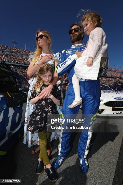 Jimmie Johnson, driver of the Lowe's Chevrolet, stands on the grid with his wife Chandra Johnson and their daughters Lydia Norriss Johnson and...