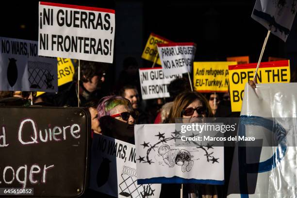 People protesting in front of the Ministry of Foreign Affairs during a demonstration against EU policies with refugees.
