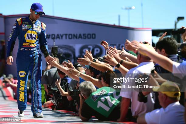 Chase Elliott, driver of the NAPA Chevrolet, waves to the crowd after being introduced prior to the 59th Annual DAYTONA 500 at Daytona International...