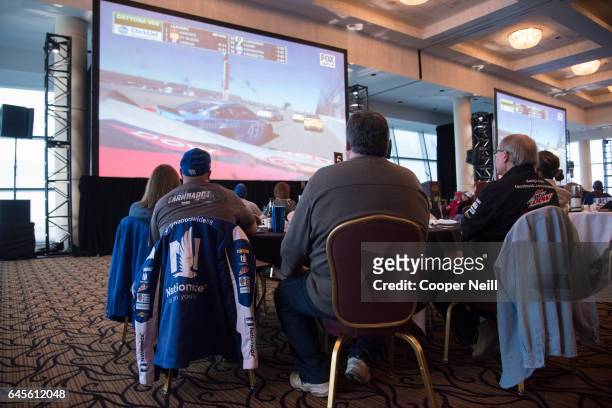 Fans watch the Daytona 500 at a watch party in the Grand Ballroom at Texas Motor Speedway on February 26, 2017 in Fort Worth, Texas.