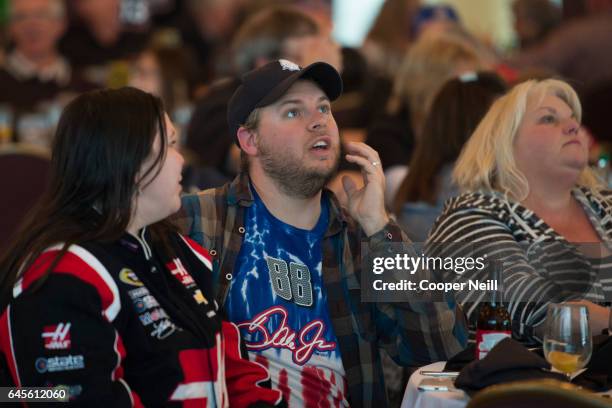 Fans watch the Daytona 500 at a watch party in the Grand Ballroom at Texas Motor Speedway on February 26, 2017 in Fort Worth, Texas.