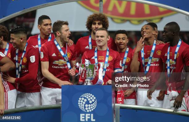 Manchester United's Wayne Rooney and Trophy during the EFL Cup Match between Manchester United and Southampton on February 26 at the Wembley Stadium,...