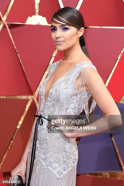 Miss Universe 2012 Olivia Culpo arrives on the red carpet for the 89th Oscars on February 26, 2017 in Hollywood, California.