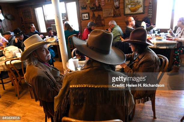 Buffalo Bill impersonators Stanley Beug, middle, sits with other impersonators as they take part in the 100th anniversary of the death of Buffalo...
