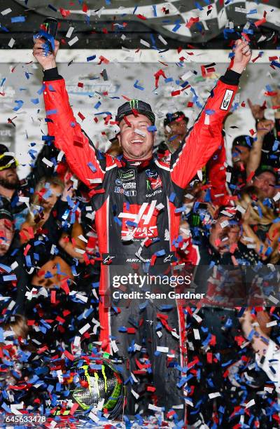 Kurt Busch, driver of the Haas Automation/Monster Energy Ford, celebrates in Victory Lane after winning the 59th Annual DAYTONA 500 at Daytona...