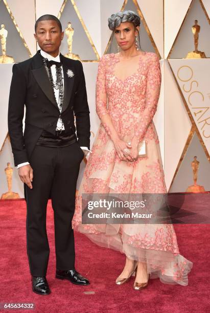 Musician Pharrell Williams and Mimi Valdes attend the 89th Annual Academy Awards at Hollywood & Highland Center on February 26, 2017 in Hollywood,...