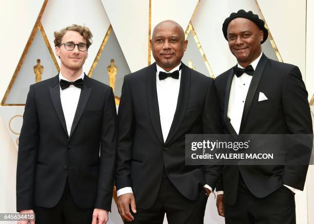 Nominee for Best Documentary Feature "I Am Not Your Negro" Raoul Peck , Rémi Grellety and Hébert Peck arrive on the red carpet for the 89th Oscars on...