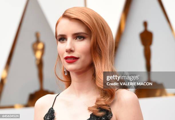 Emma Roberts arrives on the red carpet for the 89th Oscars on February 26, 2017 in Hollywood, California. / AFP / VALERIE MACON
