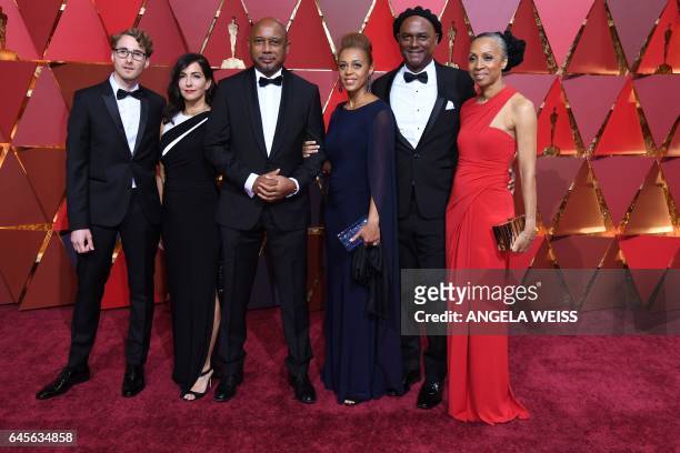 Nominees for Best Documentary Feature "I Am Not Your Negro" Raoul Peck , Remi Grellety and Hebert Peck pose as they arrive on the red carpet for the...