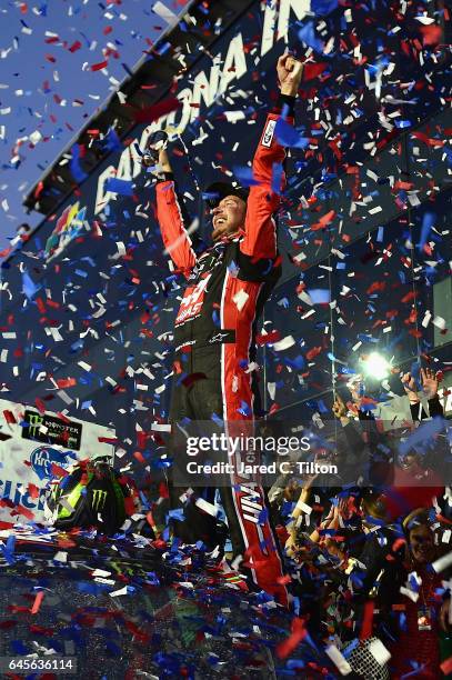 Kurt Busch, driver of the Haas Automation/Monster Energy Ford, celebrates in Victory Lane after winning the 59th Annual DAYTONA 500 at Daytona...