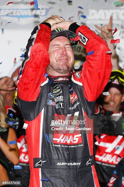 Kurt Busch, driver of the Haas Automation/Monster Energy Ford, celebrates in Victory Lane after winning the 59th Annual DAYTONA 500 at Daytona...