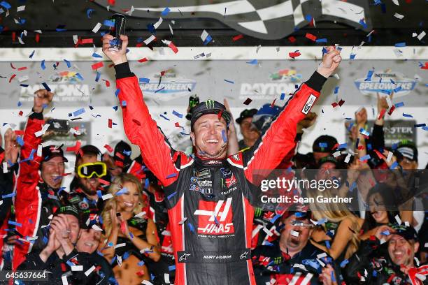 Kurt Busch, driver of the Haas Automation/Monster Energy Ford, celebrates in Victory Lane after winning the 59th Annual DAYTONA 500 at Daytona...