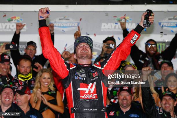 Kurt Busch, driver of the Haas Automation/Monster Energy Ford, celebrates in Victory Lane after winning the 59th Annual DAYTONA 500 at Daytona...