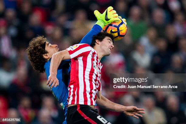 Guillermo Ochoa of Granada CF competes for the ball with Mikel San Jose of Athletic Club during the La Liga match between Athletic Club Bilbao and...