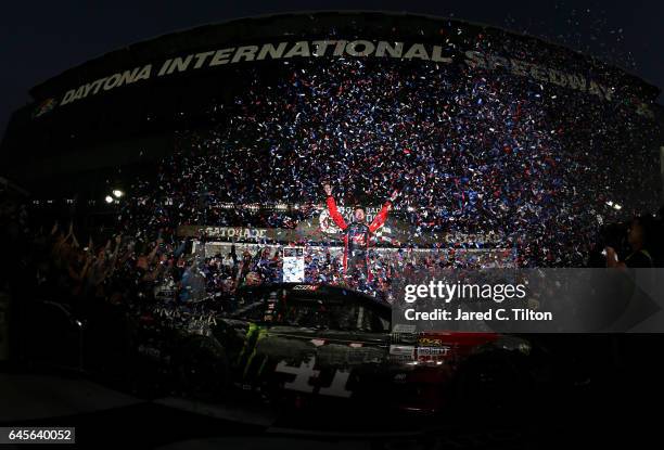 Kurt Busch, driver of the Haas Automation/Monster Energy Ford, celebrates in Victory Lane after winning the 59th Annual DAYTONA 500 at Daytona...