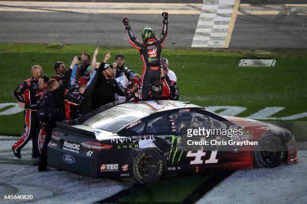 Kurt Busch, driver of the Haas Automation/Monster Energy Ford, celebrates with his crew after winning the 59th Annual DAYTONA 500 at Daytona...