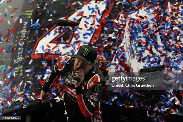 Kurt Busch, driver of the Haas Automation/Monster Energy Ford, celebrates in Victory Lane after winning the 59th Annual DAYTONA 500 at Daytona...