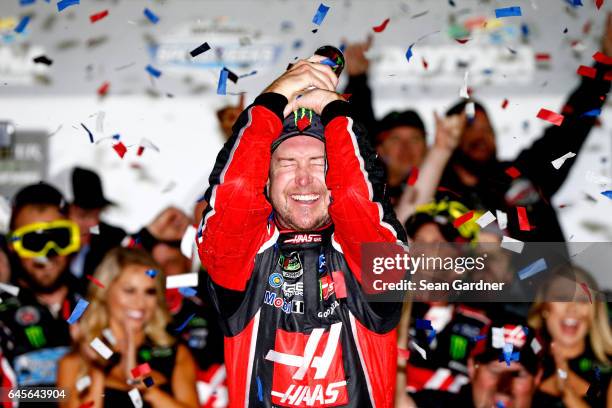 Kurt Busch, driver of the Haas Automation/Monster Energy Ford, celebrates in Victory Lane after winning the 59th Annual DAYTONA 500 at Daytona...