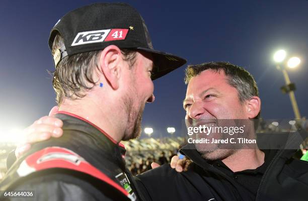 Kurt Busch, driver of the Haas Automation/Monster Energy Ford, celebrates in Victory Lane with team co-owner Tony Stewart after winning the 59th...