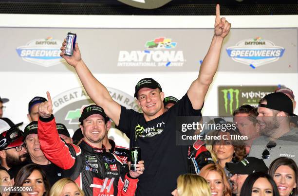 Kurt Busch, driver of the Haas Automation/Monster Energy Ford, celebrates in Victory Lane with New England Patriots tight end Rob Gronkowski after...