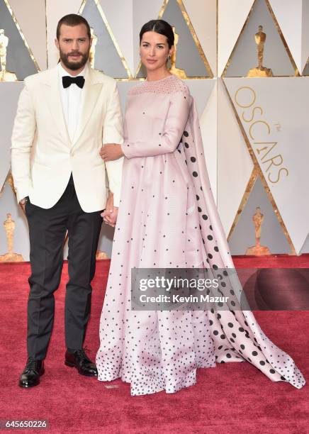 Actors Jamie Dornan and Amelia Warner attend the 89th Annual Academy Awards at Hollywood & Highland Center on February 26, 2017 in Hollywood,...