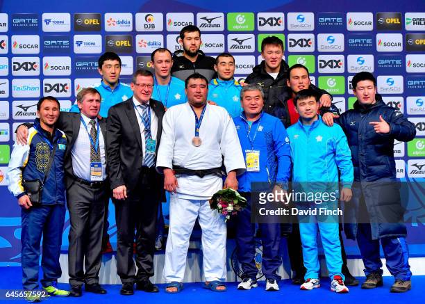 The Kazakstan team members proudly stand with Yerzhan Shynkeyev who won the o100kg bronze medal during the 2017 Dusseldorf Grand Prix at the...