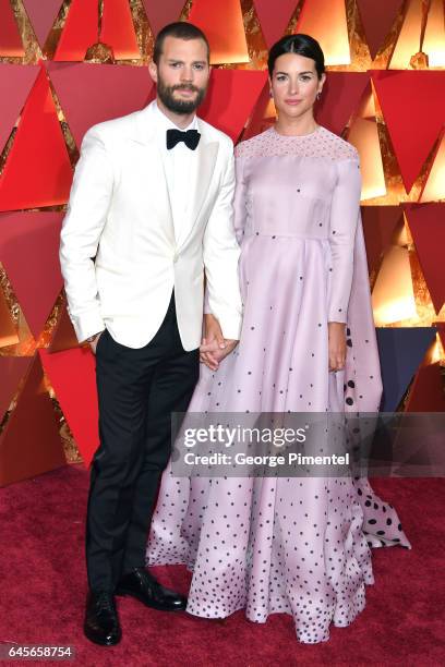 Actors Jamie Dornan and Amelia Warner attend the 89th Annual Academy Awards at Hollywood & Highland Center on February 26, 2017 in Hollywood,...