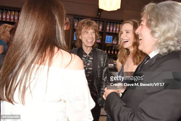 Recording artist Mick Jagger of music group The Rolling Stones, actor Kelly Lynch, and producer Mitch Glazer attend the 2017 Vanity Fair Oscar Party...