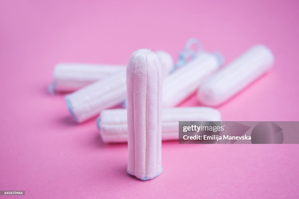 Tampons on pink background
