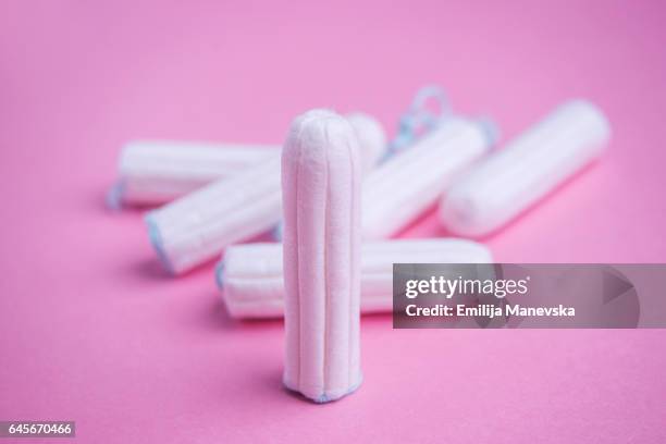 tampons on pink background - tampon stock pictures, royalty-free photos & images