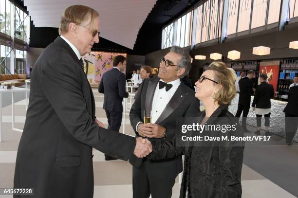 Recording artist T Bone Burnett, actor Eugene Levy, and Deborah Divine attend the 2017 Vanity Fair Oscar Party hosted by Graydon Carter at Wallis...